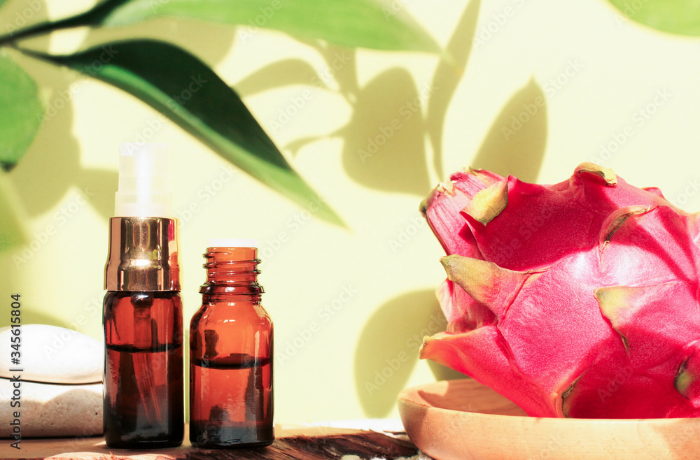 Tropical spa set with plant shadows green background, pitaya dragon fruit skin care extract, dark glass dropper bottles of essential oil, facial cosmetic product
Tropical spa set with plant shadows green background, pitaya dragon fruit skin care extract, dark glass dropper bottles of essential oil, facial cosmetic product