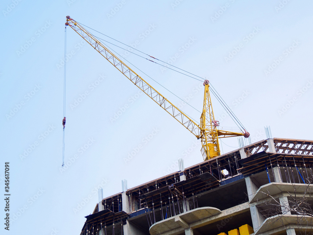 Fototapeta premium Construction site. Building site with crane. Concrete building under construction