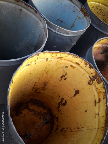 Warehouse wholesale company. There are a lot of empty old barrels in the frame. Vertical shot. Color image. Photographed in Ukraine, Kiev region.