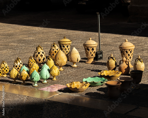 objects in Lecce stone typical of the Salento artisan tradition displayed in a city street