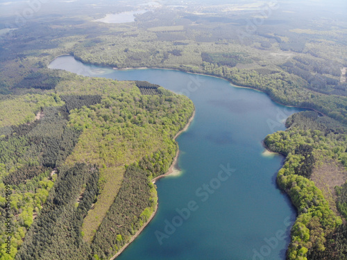 Aerial view of crystal clear Peetschsee located in Stechlin conservation area, Brandenburg Germany