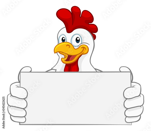 Fotografia A chicken rooster cockerel cartoon character mascot holding a sign