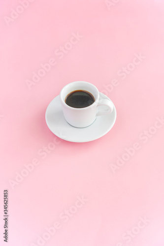 coffee mug and pink marshmallows on a pink background