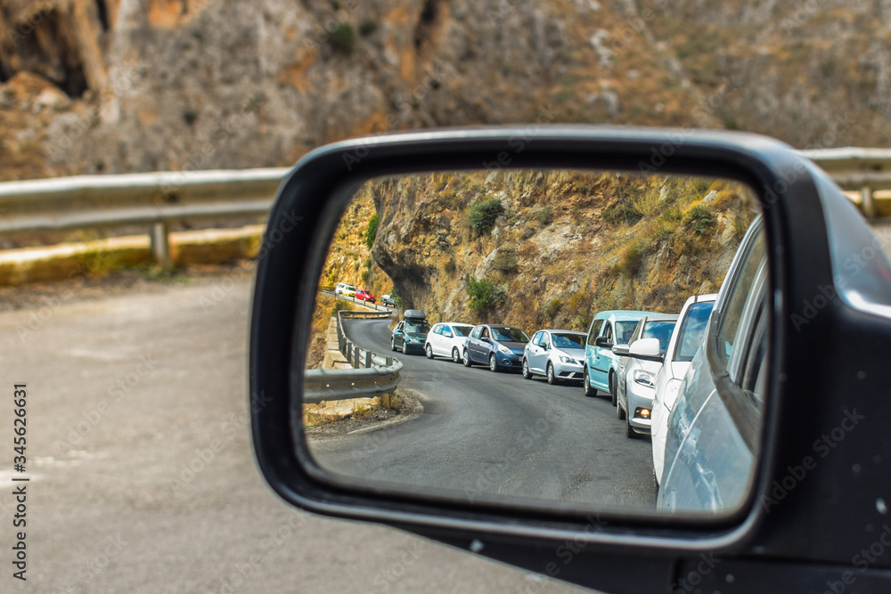 A lot of cars behind, view of reflection - side mirror. A lot of cars behind, view of reflection - side mirror.