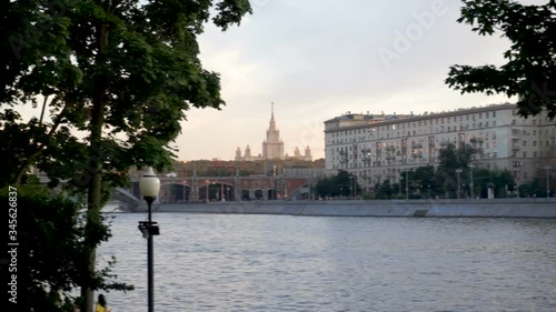 View of Moscow State University among trees from Gorky Park in Moscow, Russia in sunset time. photo