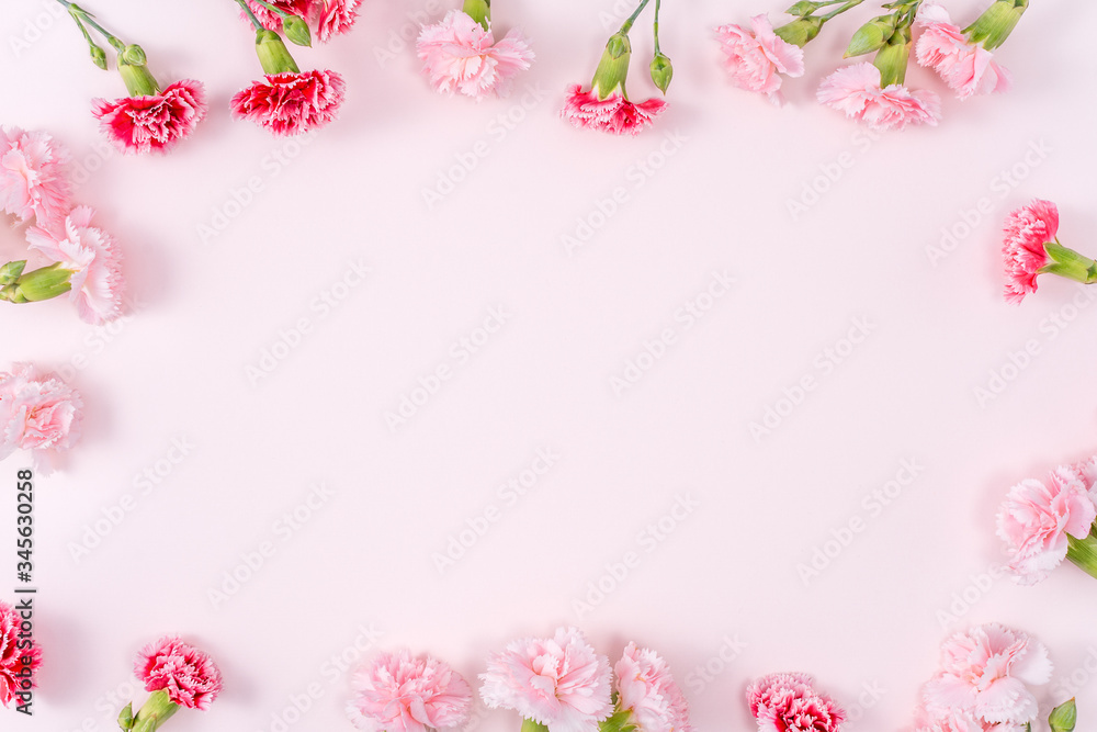 Fototapeta Mother's Day, Valentine's Day background design concept, beautiful pink, red carnation flower bouquet on pink table, top view, flat lay, copy space.