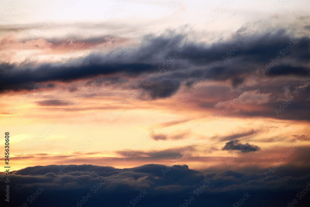 Beautiful landscape of orange evening sunset in the sky with clouds. The concept of the natural environment