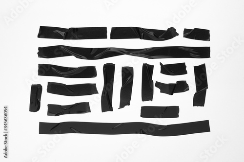 Black adhesive duct tape isolated on white background, collection. photo