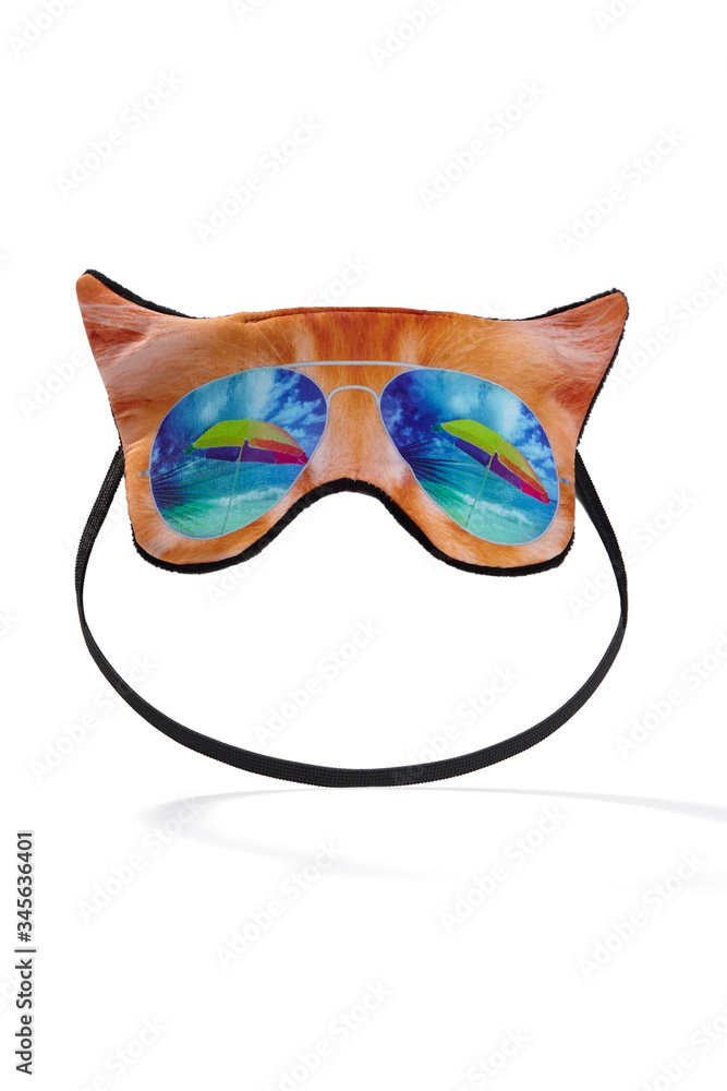 Subject shot of a sleep mask made as a funny red cat snout in sun glasses. The mask for deep sleep is isolated on the white background.