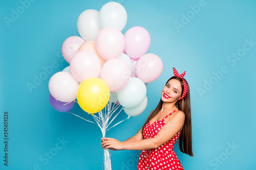 Portrait of her she nice-looking attractive lovely lovable stunning glamorous cheerful cheery straight-haired girl holding bunch air balls isolated on bright vivid shine vibrant blue color background photo