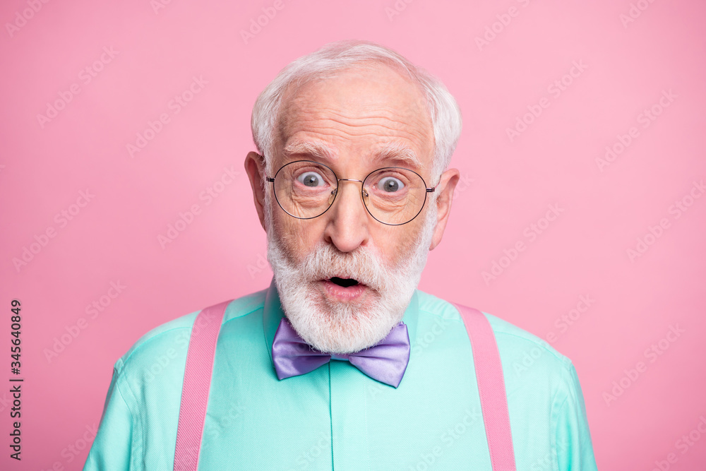 Closeup photo of attractive stylish cool clothes grandpa positive facial expression open mouth wear specs mint shirt suspenders bow tie isolated bright pink pastel color background Closeup photo of attractive stylish cool clothes grandpa positive facial expression open mouth wear specs mint shirt suspenders bow tie isolated bright pink pastel color background
