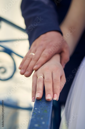 Hands of young with wedding rings