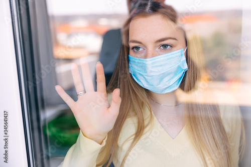 woman in isolation at home for virus outbreak. Quarantine becaus photo