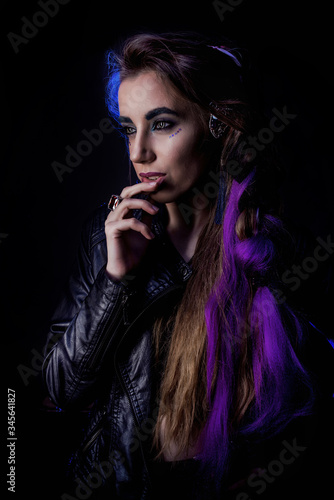 Girl in werewolf style on a black background with blue light. © Наталья Новикова