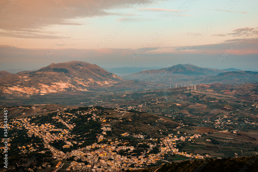 Amazing view seen from Erice Mountain, Sicily, Italy. In the landscape Trapani region, rocks, forest, buildings, cityscape. Shot during sunset, with beautiful sky colors.