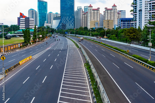 Jakarta, Indonesia - 3rd May 2020: Empty or deserted Jakarta street in times of covid 19 pandemic. People are working from home to reduce the spread of covid 19 epidemic.