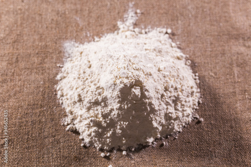 White flour on textile background texture photo