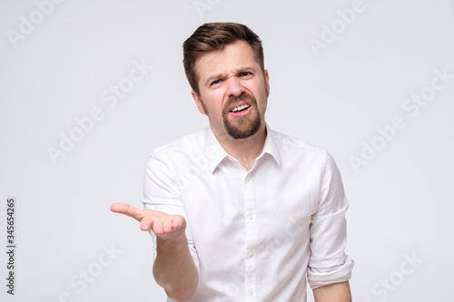 man complaining or grumbling with hands forward trying to explain his point of view