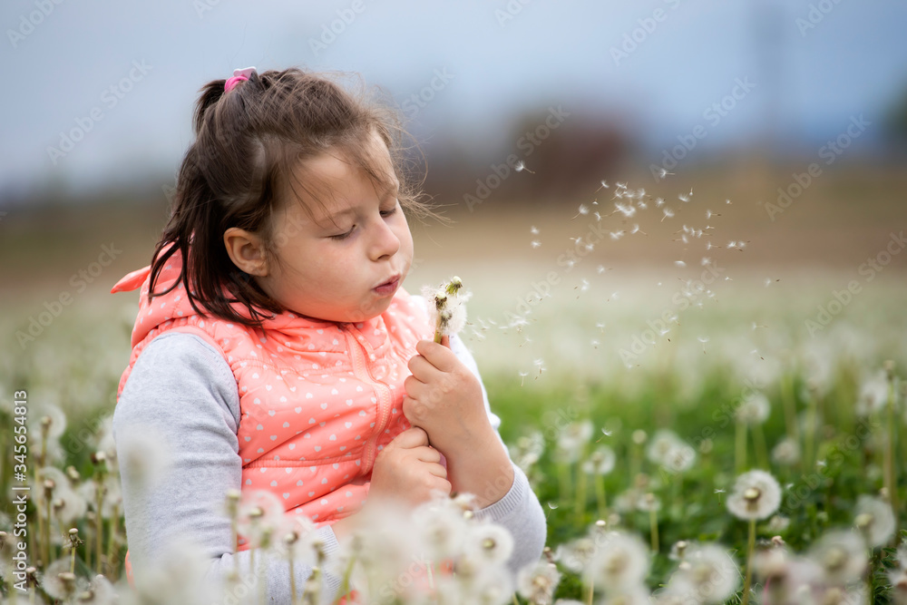 Cute little girl on the meadow in spring day Cute little girl on the meadow in spring day