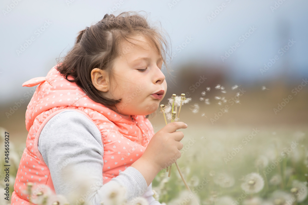 Cute little girl on the meadow in spring day Cute little girl on the meadow in spring day