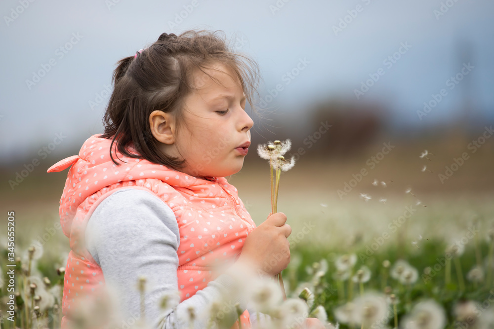 Cute little girl on the meadow in spring day Cute little girl on the meadow in spring day