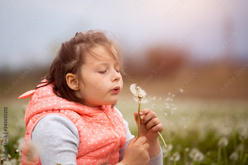 Cute little girl on the meadow in spring day Cute little girl on the meadow in spring day