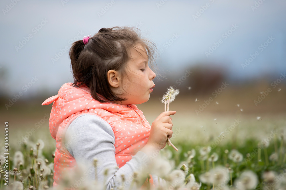 Cute little girl on the meadow in spring day Cute little girl on the meadow in spring day