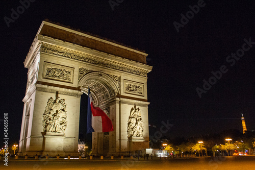 Arc de Triomphe of Paris on Charles de Gaulle Square at night