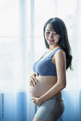 Happy pregnant woman with big belly. Free Download Happy pregnant woman with big belly. - GFXLoad