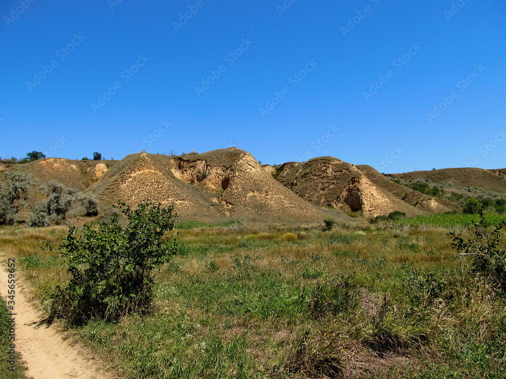 Sand hills against the blue sky. Sand hills against the blue sky.