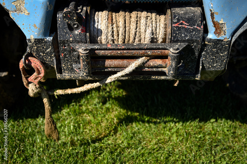 Obraz na plátně Off road vehicle obsolete rope winch detail with steel red hook