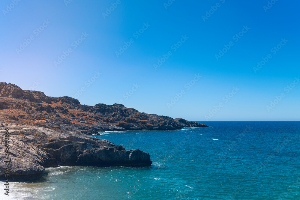 rocky bays on crete with blue sea and sky