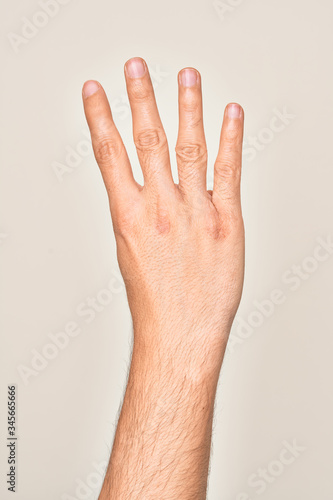 Hand of caucasian young man showing fingers over isolated white background counting number 4 showing four fingers