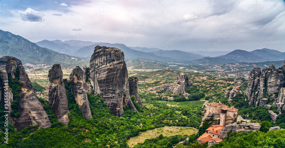 Rock formation and monastery in the mountain landscape of Meteora, Greece