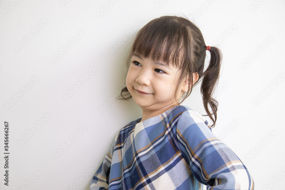half-body and front-view photo of adorable, three-year-old Asian girl posing on a white background shows her brightness that makes people look happy, bright and cute. half-body and front-view photo of adorable, three-year-old Asian girl posing on a white background shows her brightness that makes people look happy, bright and cute.