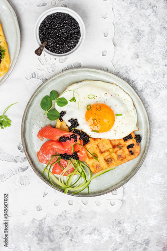 potato savory waffles with salmon, egg and caviar