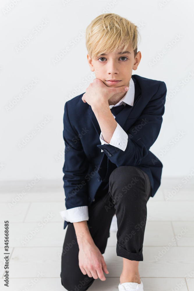 Puberty concept - Teenage boy portrait on a white background. Puberty concept - Teenage boy portrait on a white background.