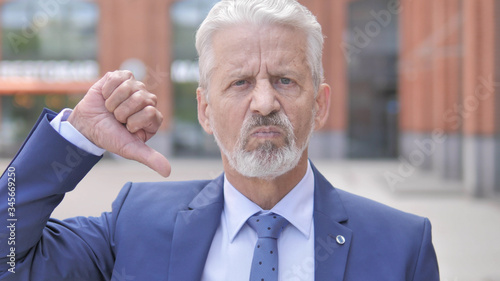 Photography Thumbs Down by Old Businessman Standing Outdoor