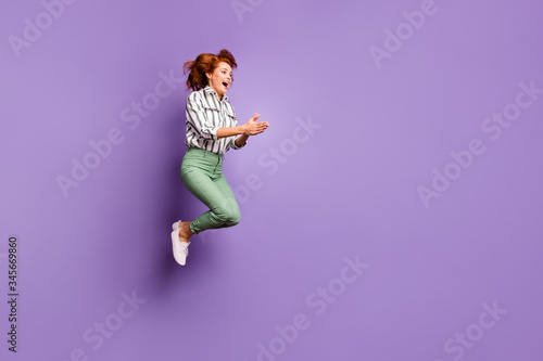 Full length profile side photo of funky lovely woman jump enjoy rejoice want dive in pool copyspace wear good look clothing gumshoes isolated over violet color background