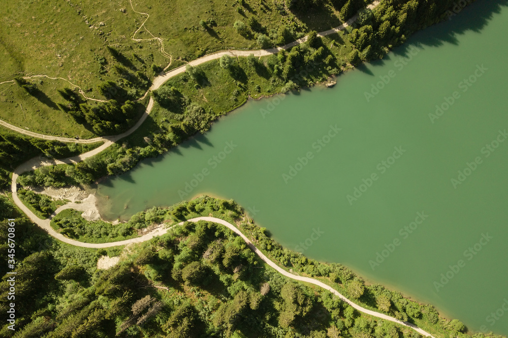 Aerial view of lake shore with hiking trail