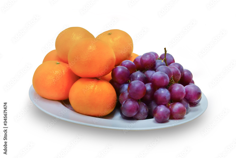 Fruits, grapes and oranges placed on a white container, on white isolated background. Fruits, grapes and oranges placed on a white container, on white isolated background.