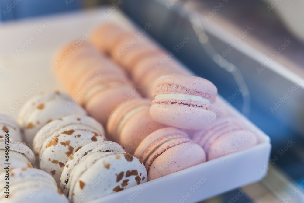 Fototapeta premium A french sweet delicacy, macaroons variety close-up on a showcase