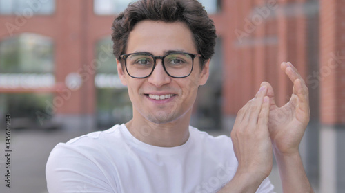 Applauding Young Man, Clapping for Appriciation photo