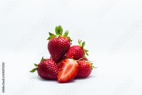 Fresh strawberries closeup isolated on white background.
