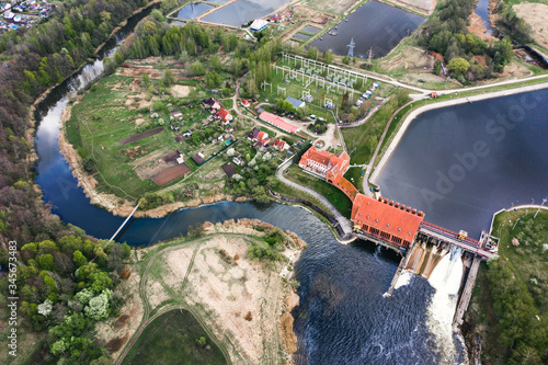 Operating hydroelectric power station, top view. Green energy. Renewable energy source. Aerial photo from the drone. photo