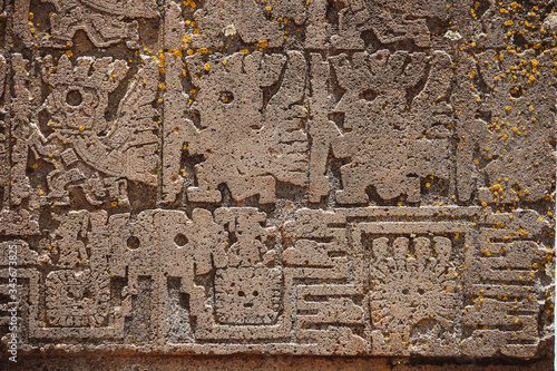 detail of the decorative reliefs of the Puerta del Sol in Tiwanaku, Bolivia photo