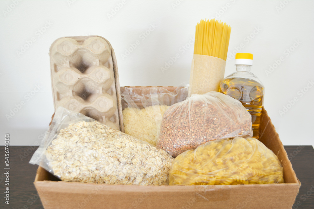 Food delivery, donation box, food box. Long-term storage products. Food supplies for the period of quarantine isolation. Food delivery, donation box, food box. Long-term storage products. Food supplies for the period of quarantine isolation.