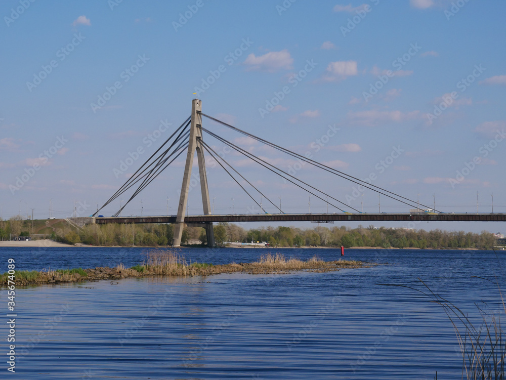 Obraz premium North Bridge Moscow Bridge across Dnieper River from Obolonskaya Embankment ,Kyiv Ukraine.