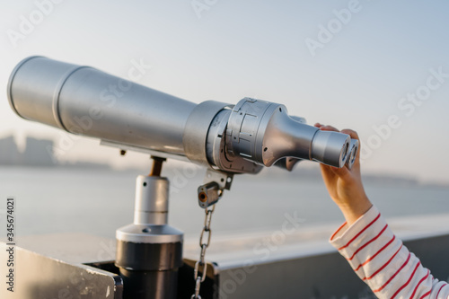 coin operated binoculars with city skyline