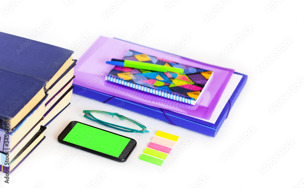 Work from home, green screen mobile smartphone, laptop, books and notebook. Education background, workplace at home during the pandemic. The quarantine concept of stay home stop coronavirus COVID-19. Work from home, green screen mobile smartphone, laptop, books and notebook. Education background, workplace at home during the pandemic. The quarantine concept of stay home stop coronavirus COVID-19.
